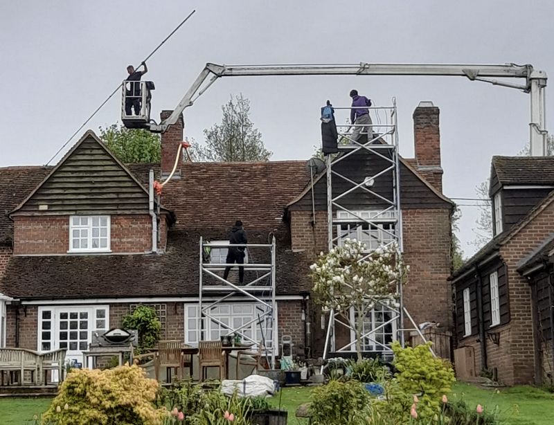 The Roof Moss Cleaners using cherry picker and scaffolding to clean roof safely and professionally in Rickmansworth, Hertfordshire