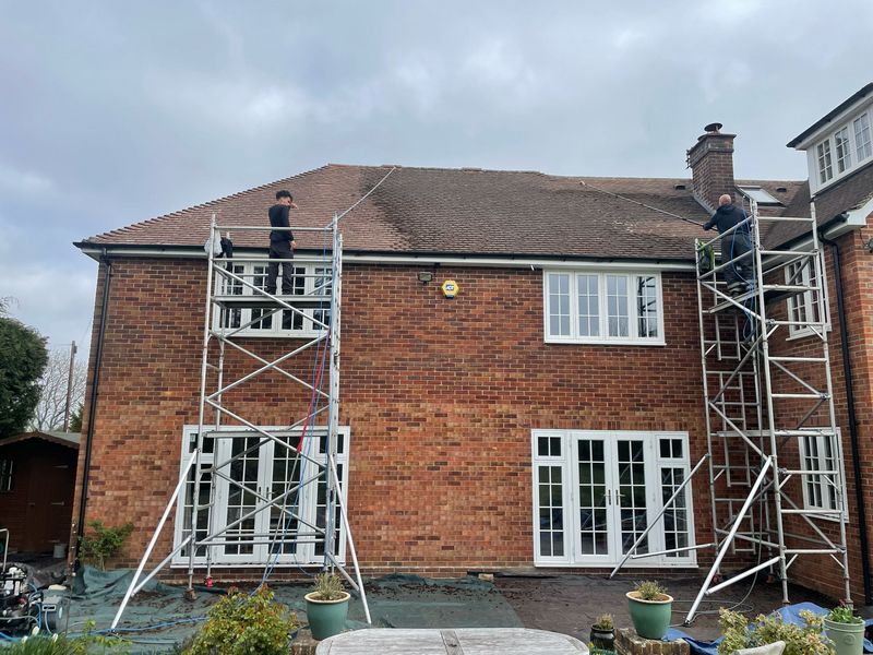 Roof cleaning carried out safely from scaffold towers by The Roof Moss Cleaners in Rickmansworth